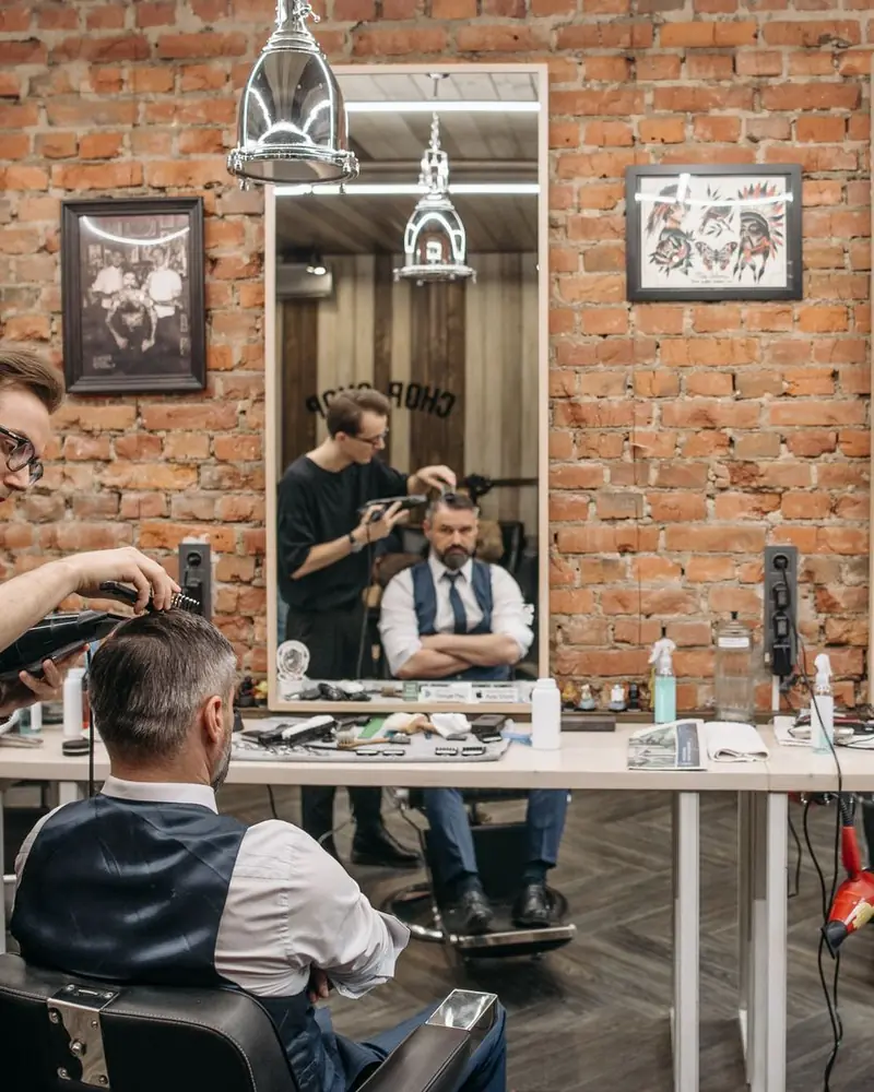 Barber cutting a client's hair