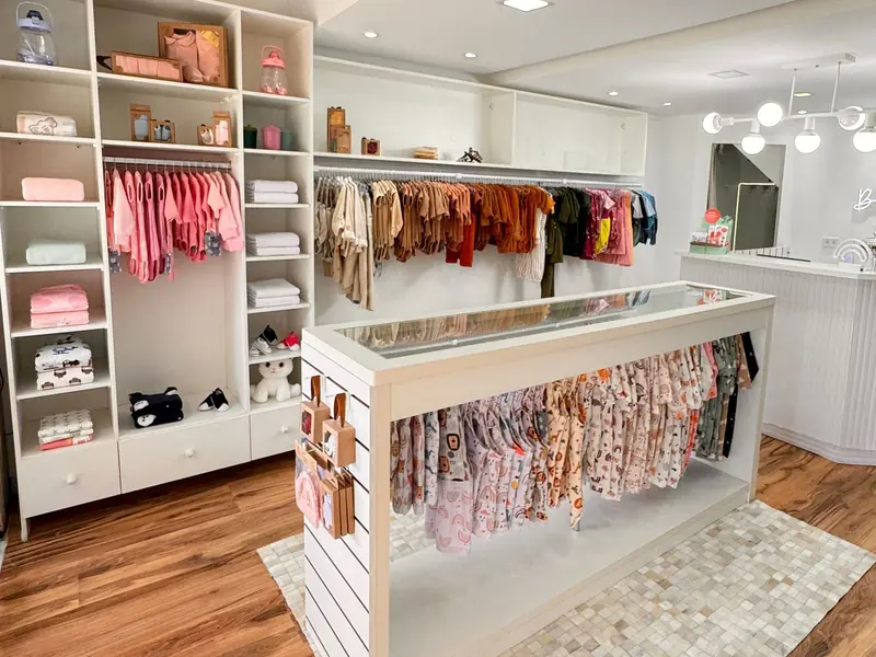 Bright boutique with clothing racks