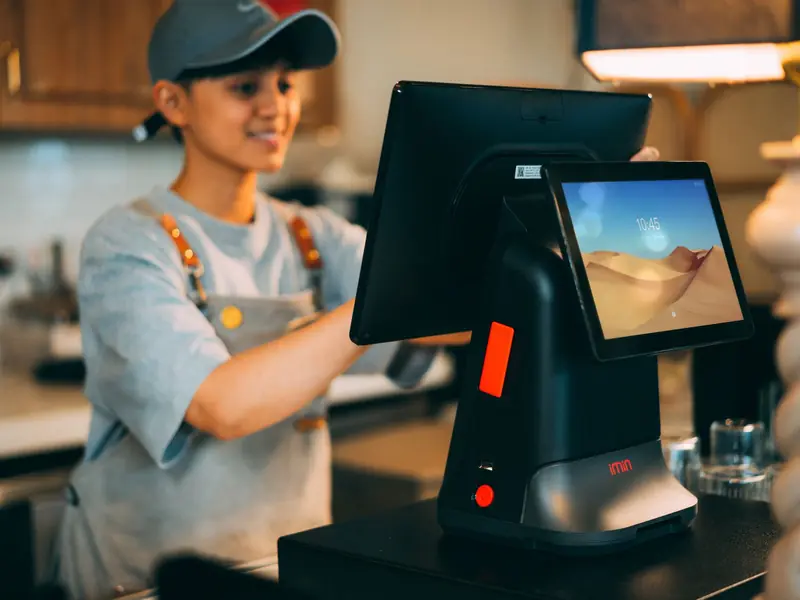 Shop employee at a point-of-sale register
