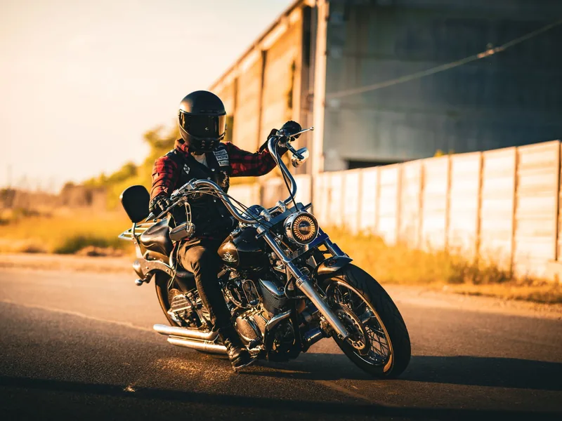 Motorcyclist on a cruiser in sunset light