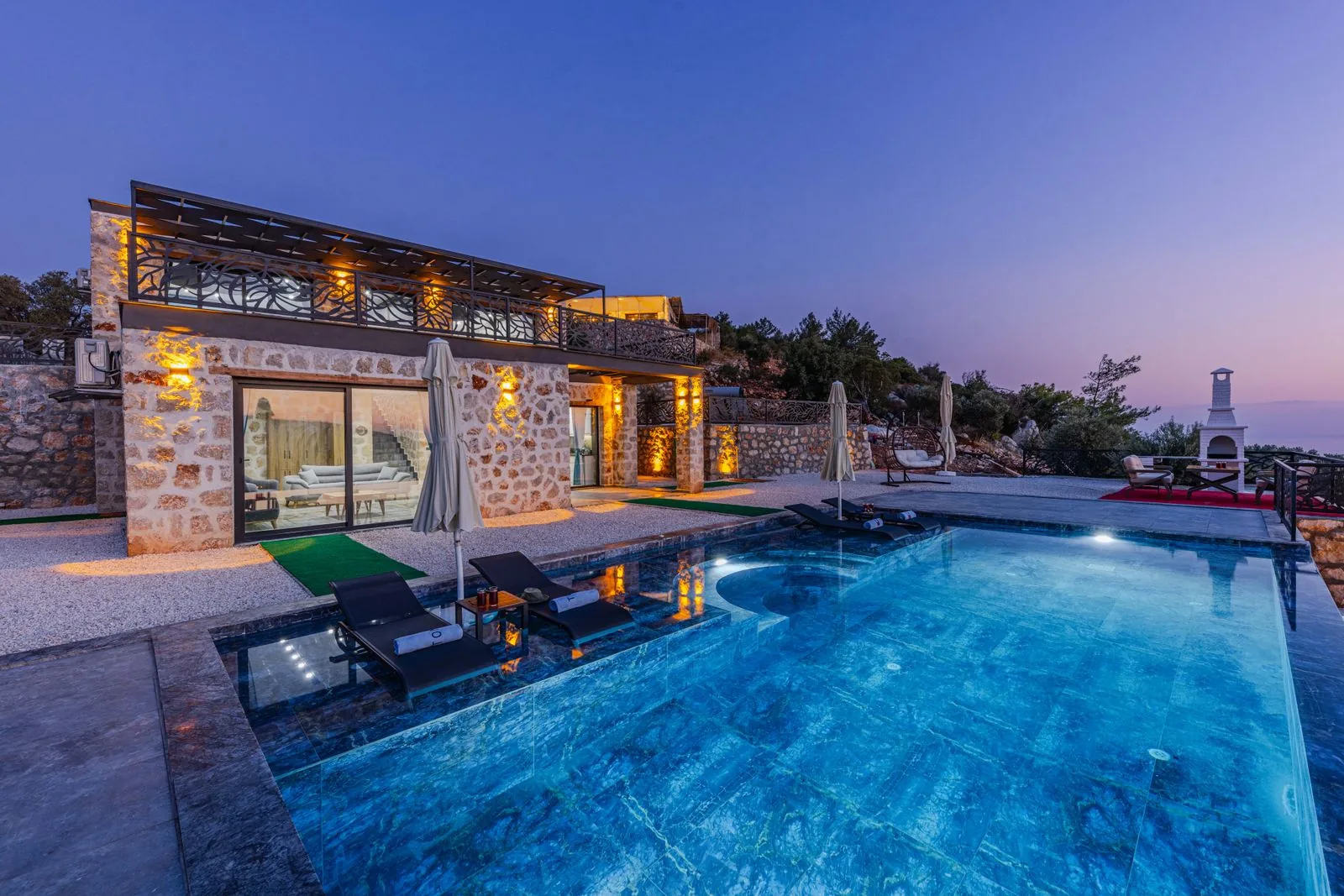 Luxury villa with pool at dusk