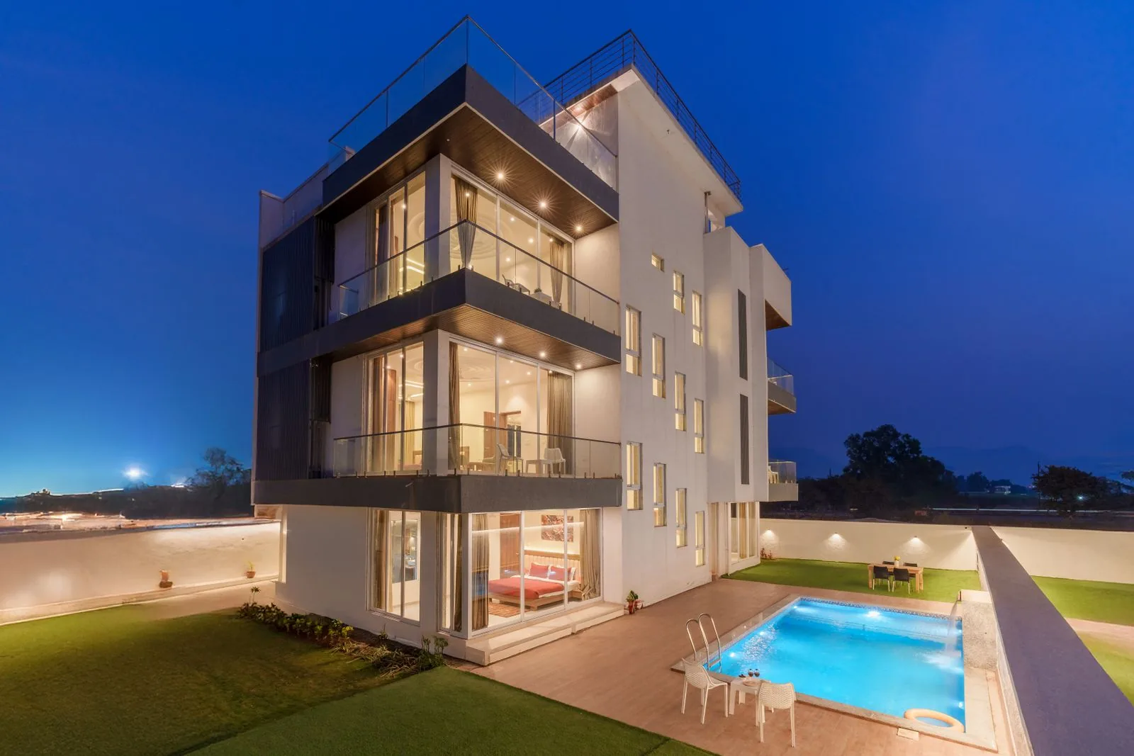 Modern luxury villa with pool at twilight